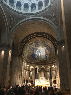 Interior of Sacre-Coeur basilica, its huge apse mosaic of Christ with outstretched arms above the altar