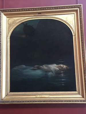 Gilt-framed painting at the Louvre of a young woman with a faint halo floating in dark water