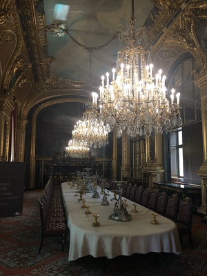 Opulent dining room in the Louvre&rsquo;s Napoleon III apartments, crystal chandeliers over a long set table