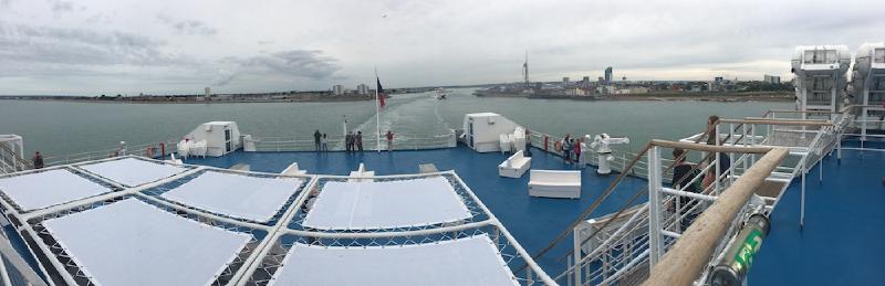 Ferry stern deck with sun loungers as the ship leaves Portsmouth harbor, the Spinnaker Tower on the skyline